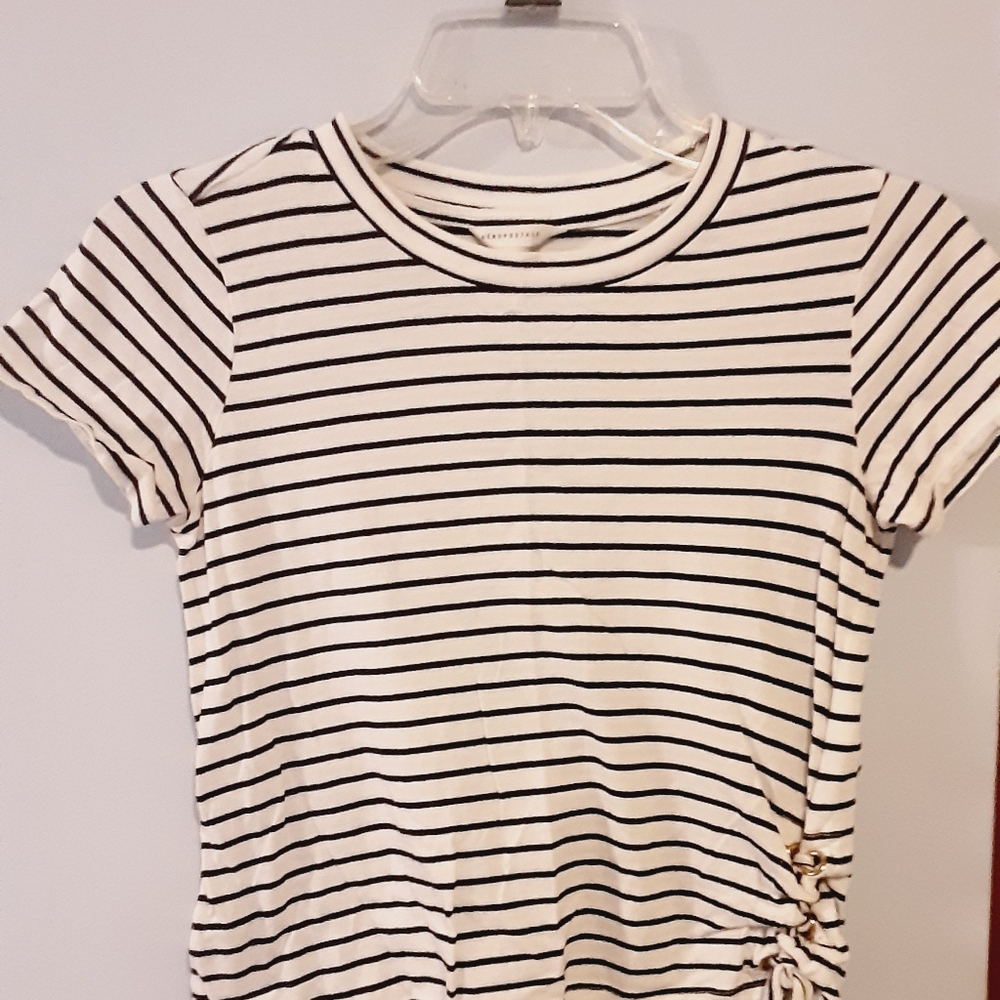 Short sleeve black and white crop top with side ties.